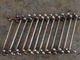 six pairs of stainless steel screws on a counter top