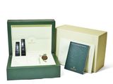 an image of a box with a watch and a book in it