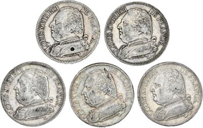 quatre pièces d'argent sur lesquelles figurent les portraits d'un homme et d'une femme
