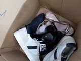 a cardboard box with a pair of shoes inside of it