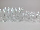 a lot of wine glasses that are sitting on a table