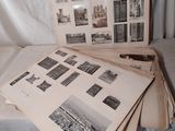 une pile de vieilles photos posée sur un lit, avec une feuille de papier à côté