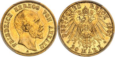 a gold coin with an eagle on the front and a head of a man on the back