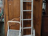 a ladder leaning against a wooden cabinet in a room