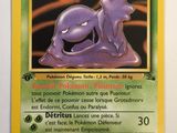 a close up of a pokemon card on a white surface