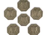 six different types of coins are shown on a white surface
