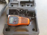 an orange and black cell phone sitting in a case