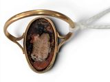 an image of a gold ring with a stone in it
