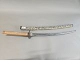a knife that is laying on a table