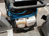 an image of a machine that is sitting in a garage