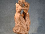 statue of a woman holding a child in her arms