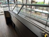 a glass display case in the middle of a store