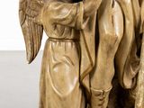 an image of a statue of an angel holding a child