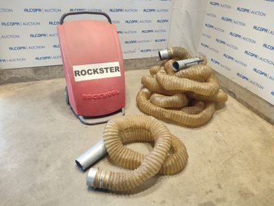 a hose and a blow dryer sitting on the floor