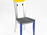 the chair is made out of plastic and has a black seat with a yellow seat