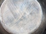 a close up of a metal pot with a handle
