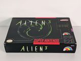 a box with a picture of an alien on it sitting on a table