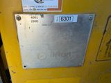 a sign on the side of a yellow machine