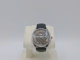 an image of a watch on a display stand with a white background