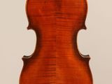 an old violin with a wooden back and a long neck