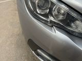 a close up of a car ' s headlight and front bumper