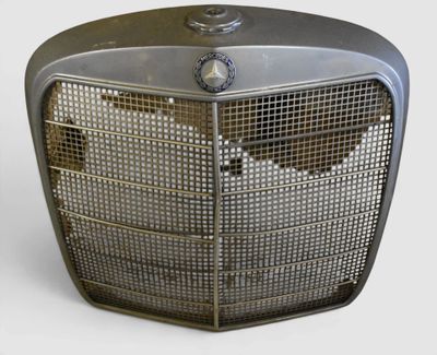 an old fashioned radiator sitting on a white surface