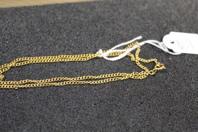 a gold chain with a tag attached to it