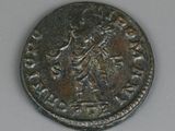 an old coin with a woman on it sitting on a table