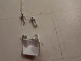 a picture of a piece of white electrical equipment on the floor