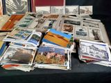 a lot of old books on a table with pictures