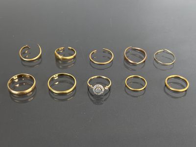 a bunch of rings sitting on top of a table next to each other