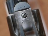 a close up of a gun that is sitting on a table