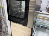 a small oven in the middle of a kitchen