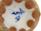 a close up view of a blue and white vase