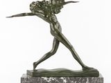 a bronze statue of a woman holding a tennis racquet on a marble base
