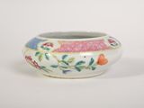 a small white bowl with a colorful design on it