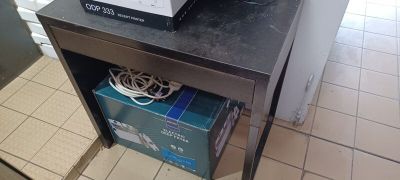 a microwave sitting on top of a table in a kitchen