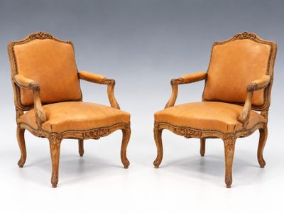 pair of louis ii style carved leather armchairs