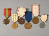 a group of medals and medals on display on a table