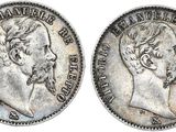 a silver coin with an image of a man on it