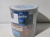 a can of paint that is sitting on a table