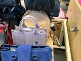 a lot of bags that are sitting on a table
