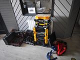 a stack of tools sitting on the floor in front of a window