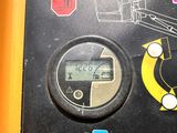a close up of a digital meter on a table