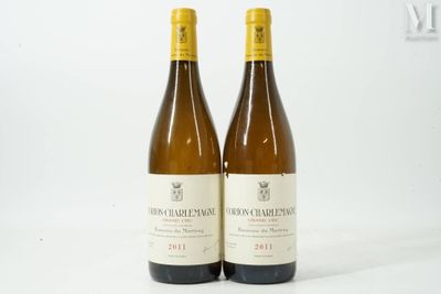 two bottles of wine sitting next to each other on a white surface