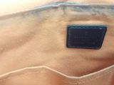 a close up of the inside of a beige purse