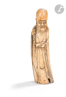 une image représentant une figurine sculptée d'un homme barbu