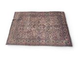 an antique persian rug on a white background