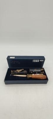 two pens in a blue box on a white surface