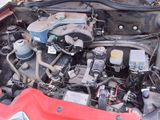 a red car engine with its hood open